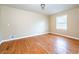 Empty bedroom featuring hardwood floors and neutral paint at 2727 Whites Mill Ct, Decatur, GA 30034