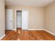 Bedroom with wood floors, closet with sliding doors, and door to another room at 2727 Whites Mill Ct, Decatur, GA 30034