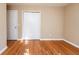 Bedroom with wood floors, closet with sliding doors, and door to another room at 2727 Whites Mill Ct, Decatur, GA 30034