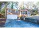 Brick home with a two-car garage and a concrete driveway at 2727 Whites Mill Ct, Decatur, GA 30034