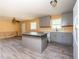 Open concept kitchen with gray cabinets and stainless steel appliances at 2727 Whites Mill Ct, Decatur, GA 30034