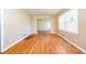 Empty living room featuring hardwood floors and neutral paint at 2727 Whites Mill Ct, Decatur, GA 30034