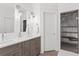 Bright bathroom with a double vanity, modern fixtures, a walk-in shower and ship lap walls at 273 Glenwood Se Ave # B, Atlanta, GA 30312