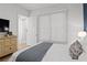 Cozy bedroom featuring a comfortable bed, a window with blinds, and a dresser for ample storage at 273 Glenwood Se Ave # B, Atlanta, GA 30312