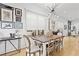Stylish dining area with a unique light fixture, gallery wall, and a rustic table, perfect for entertaining and everyday living at 273 Glenwood Se Ave # B, Atlanta, GA 30312