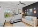 Versatile room features a treadmill, comfortable seating, stylish art and plenty of natural light at 273 Glenwood Se Ave # B, Atlanta, GA 30312