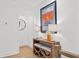 Bright hallway featuring hardwood floors, art, lamps and an inviting view into another room at 273 Glenwood Se Ave # B, Atlanta, GA 30312