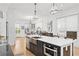 Bright kitchen showcasing a large island, stainless steel appliances, and an open layout leading to the dining and living areas at 273 Glenwood Se Ave # B, Atlanta, GA 30312