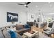 Spacious living room with a comfortable gray sofa, stylish decor, and an open view into the modern kitchen at 273 Glenwood Se Ave # B, Atlanta, GA 30312