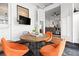 Enclosed patio featuring orange chairs around a round table, creating a cozy and inviting outdoor space at 273 Glenwood Se Ave # B, Atlanta, GA 30312
