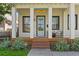 Inviting front porch with classic columns, a cozy seating area, and a welcoming entrance with charming details and curb appeal at 273 Glenwood Se Ave # B, Atlanta, GA 30312