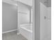 Modern bathroom featuring a soaking tub and a white shower stall at 7176 Ravenwood Ln, Lithonia, GA 30038