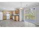 Functional kitchen with white appliances and sliding glass doors to the back deck at 7176 Ravenwood Ln, Lithonia, GA 30038