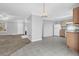 Inviting living space featuring a fireplace, bright kitchen, and a seamless open layout at 7176 Ravenwood Ln, Lithonia, GA 30038