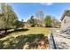Tranquil backyard view from the deck, highlighting the property's expansive green space and natural surroundings at 3582 Ontario Ct, Buford, GA 30519