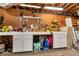 Organized basement workshop with pegboard wall, workbench, and storage cabinets at 3582 Ontario Ct, Buford, GA 30519