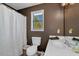 Stylish bathroom with a white vanity, dark walls, and modern fixtures at 3582 Ontario Ct, Buford, GA 30519