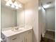 Cozy bathroom showcasing a white vanity and shower with a patterned curtain and neutral wall colors at 3582 Ontario Ct, Buford, GA 30519