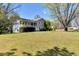 Well-maintained home with a large front yard, showcasing its exterior and landscaped surroundings at 3582 Ontario Ct, Buford, GA 30519