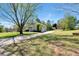 Inviting home featuring a long driveway and well-kept lawn, offering a picturesque curb appeal at 3582 Ontario Ct, Buford, GA 30519