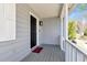 Welcoming covered porch with stylish lighting and a charming plaid welcome mat at 3582 Ontario Ct, Buford, GA 30519