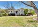 Attractive home with a spacious front yard, providing curb appeal and a welcoming entrance at 3582 Ontario Ct, Buford, GA 30519