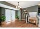 Upstairs hallway with natural light, staircase access and decorative shelving at 3582 Ontario Ct, Buford, GA 30519