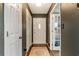 Hallway with hardwood floors and multiple storage options including a coat closet at 3582 Ontario Ct, Buford, GA 30519