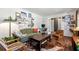 Cozy living room boasts a decorative rug, comfortable seating, and a gallery wall with personal touches at 3582 Ontario Ct, Buford, GA 30519
