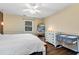 Cozy primary bedroom featuring soft lighting, neutral tones, and a comfortable bed at 3582 Ontario Ct, Buford, GA 30519