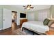Light and airy main bedroom with pale green walls, a queen bed and laminate flooring at 3582 Ontario Ct, Buford, GA 30519
