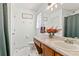 Bright bathroom featuring a vanity with storage, a toilet, and a shower with curtain at 38 Wayfaring Ct, Rockmart, GA 30153