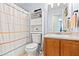 Well-lit bathroom with a decorative shower curtain and a built-in storage unit at 38 Wayfaring Ct, Rockmart, GA 30153
