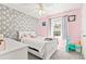 Charming bedroom with playful wallpaper and a comfortable single bed at 38 Wayfaring Ct, Rockmart, GA 30153