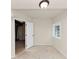 Unfinished basement with a new door, white walls, and a small window at 2480 Miriam Ln, Decatur, GA 30032