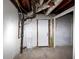 Utility room with pipes and white cinder block walls at 2480 Miriam Ln, Decatur, GA 30032