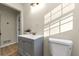 A bright bathroom featuring a grey vanity and tile floors at 2480 Miriam Ln, Decatur, GA 30032
