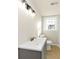 Bright bathroom with updated vanity, modern fixtures, and natural light from the window at 2480 Miriam Ln, Decatur, GA 30032