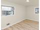 Bedroom featuring light wood floors, neutral walls, and bright natural light at 2480 Miriam Ln, Decatur, GA 30032