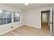 Bedroom featuring light wood floors, neutral walls, and bright natural light at 2480 Miriam Ln, Decatur, GA 30032