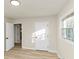 Bedroom featuring light wood floors, and ample natural light with white walls at 2480 Miriam Ln, Decatur, GA 30032