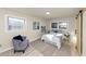 Cozy bedroom featuring a comfortable bed, accent chair, and stylish sliding barn door at 2480 Miriam Ln, Decatur, GA 30032