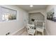 Bright dining area with table and chairs next to the staircase and window at 2480 Miriam Ln, Decatur, GA 30032