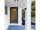 Inviting front door with sidelight and overhead light fixture at 2480 Miriam Ln, Decatur, GA 30032