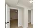 Neutral colored hallway featuring tiled floors and several doors at 2480 Miriam Ln, Decatur, GA 30032