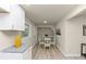Hallway featuring a dining area and stylish white cabinets at 2480 Miriam Ln, Decatur, GA 30032