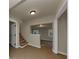 An open hallway with a carpeted staircase and tile floors at 2480 Miriam Ln, Decatur, GA 30032