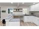 Kitchen with white cabinets, granite counters, and a breakfast bar at 2480 Miriam Ln, Decatur, GA 30032