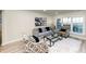 Bright living room featuring large windows, hardwood floors, and modern decor at 2480 Miriam Ln, Decatur, GA 30032