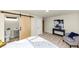 Comfortable main bedroom featuring a barn door to an ensuite bath and modern decor at 2480 Miriam Ln, Decatur, GA 30032